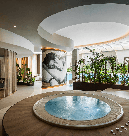 Spa wellness lounge with circular jacuzzi representing UHM's wellness expertise
