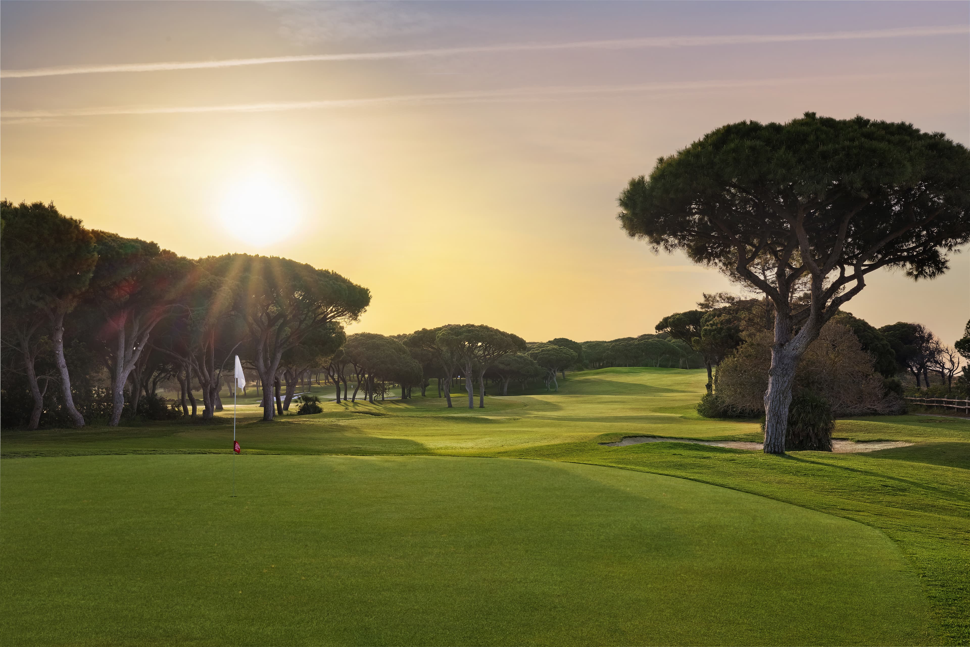 Sunset over a golf green at Pine Cliffs Resort