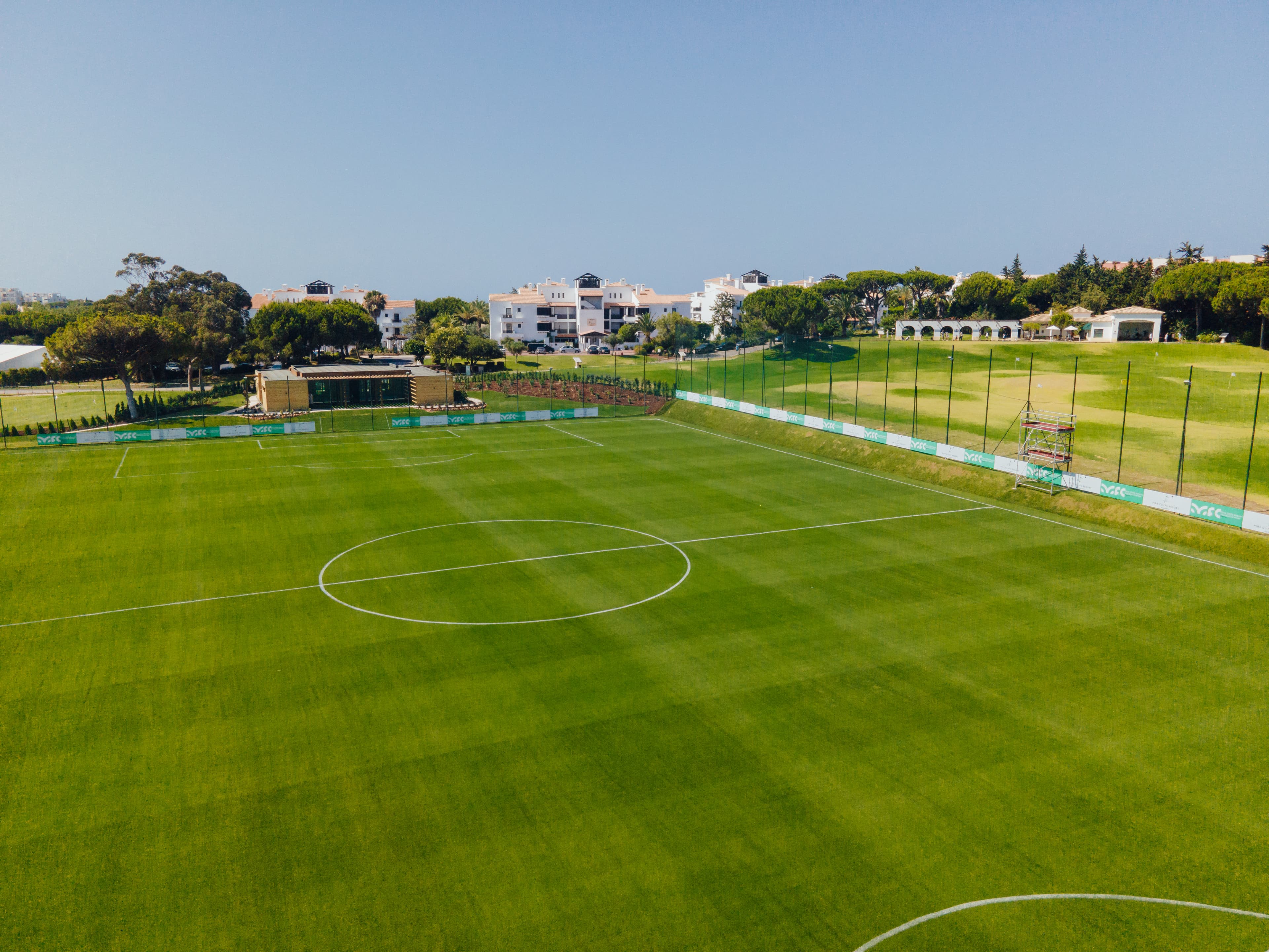 Aerial view of the football pitch and golf course at Pine Cliffs Resort